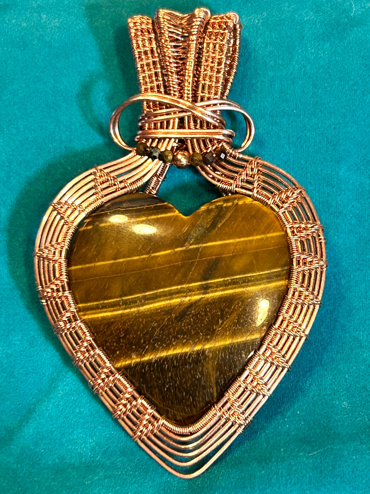 Copper wire wrapped tiger's eye heart pendant approximately 3 inches long
