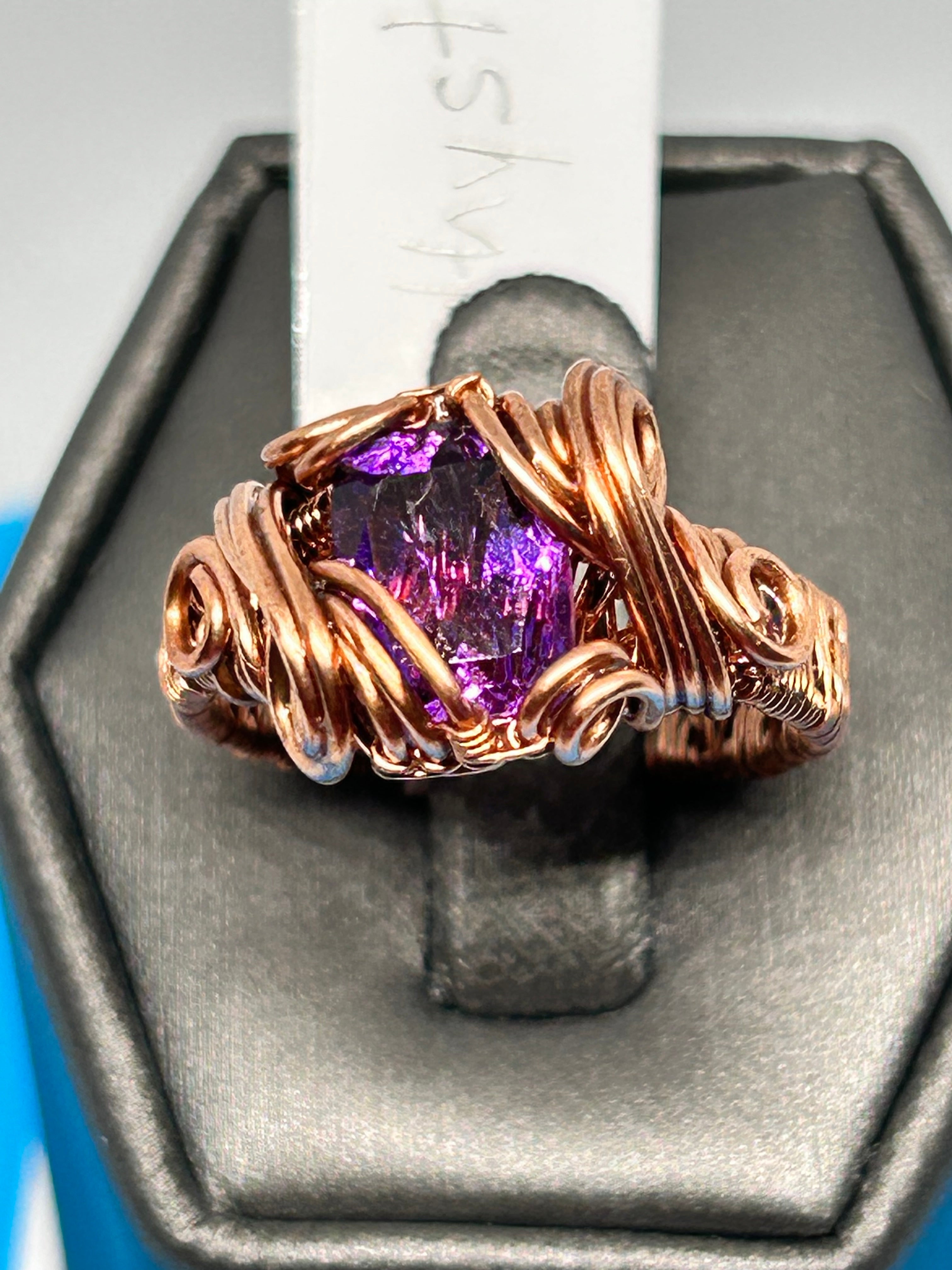 Copper wire wrapped raw Amethyst ring size 8.5 on ring display, showing vivid purple crystal
