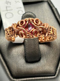 Copper wire wrapped pink topaz faceted ring size 10 with woven scroll vine setting