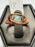 Copper wire wrapped larimar oval cabochon ring size 7 with open scroll setting