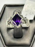 Silver tone wire wrapped faceted oval amethyst ring size 6.5 with claw and chain-link loop frame setting