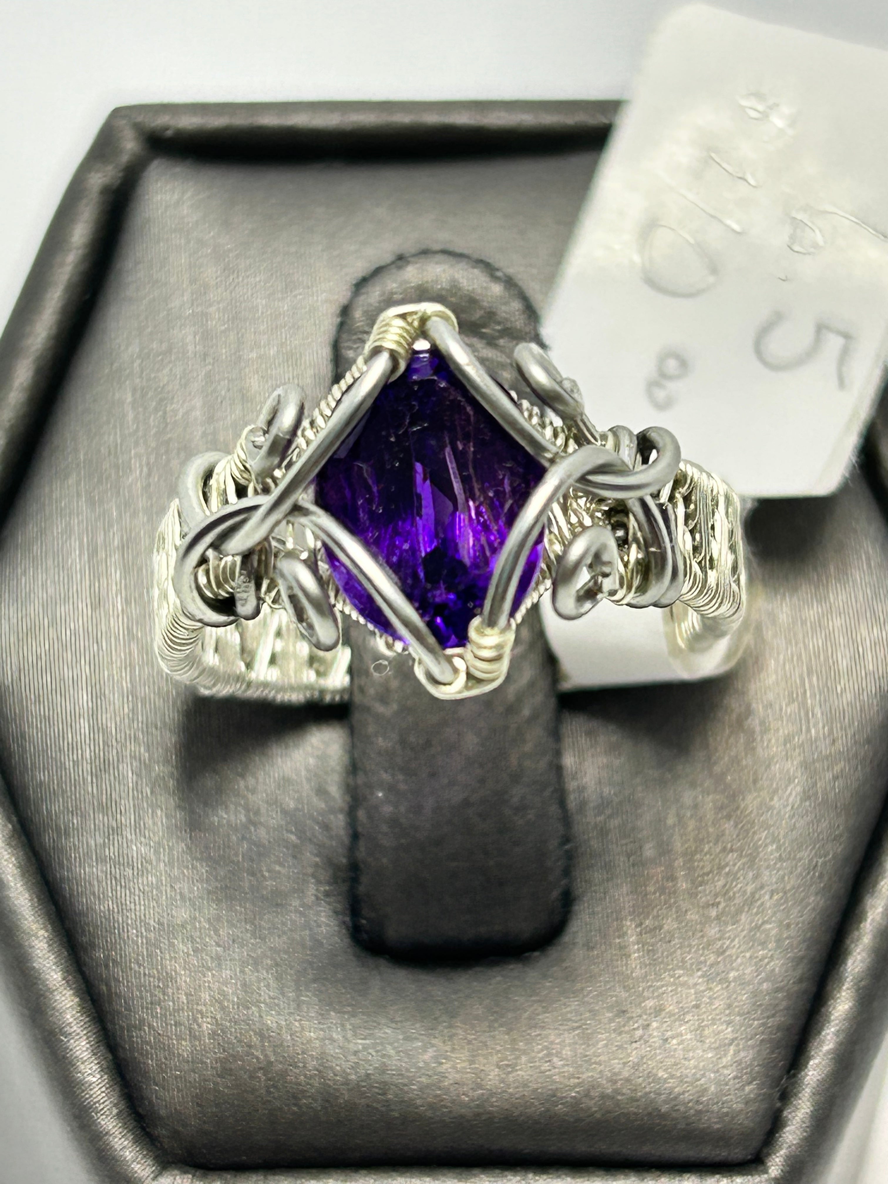 Silver tone wire wrapped faceted oval amethyst ring size 6.5 with claw and chain-link loop frame setting