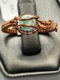 Copper wire wrapped larimar oval cabochon ring size 8 with wave-style curved wire frame