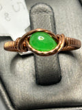 Copper wire wrapped green jade oval cabochon ring size 8.5 with simple oval frame and crossover knot accents