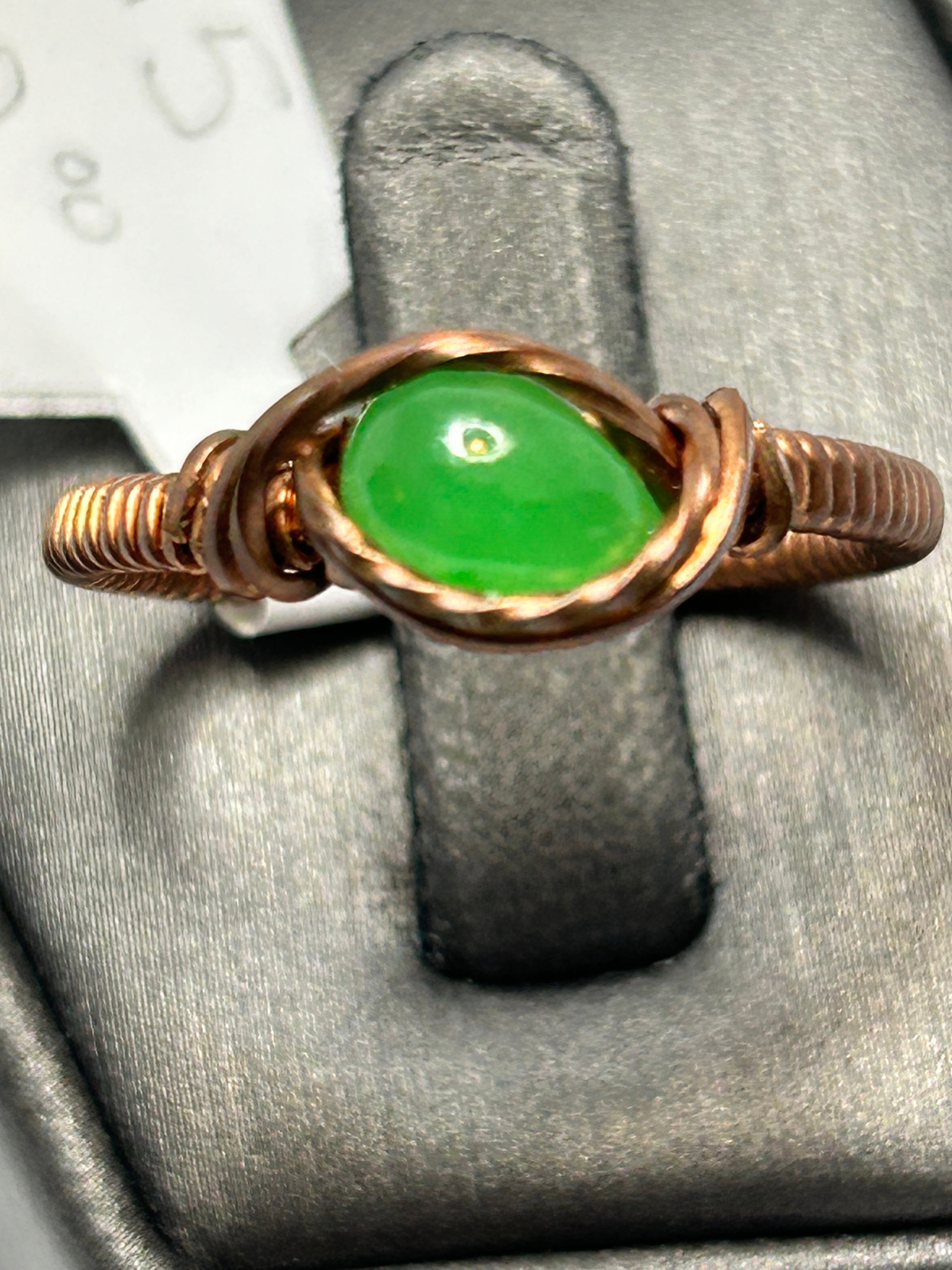 Copper wire wrapped green jade oval cabochon ring size 8.5 with simple oval frame and crossover knot accents