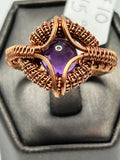 Copper wire wrapped amethyst cabochon ring size 10 with four-petal coiled wire setting