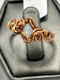 Copper wire wrapped aquamarine ring size 7 with sculptural copper rose accents and diamond frame setting