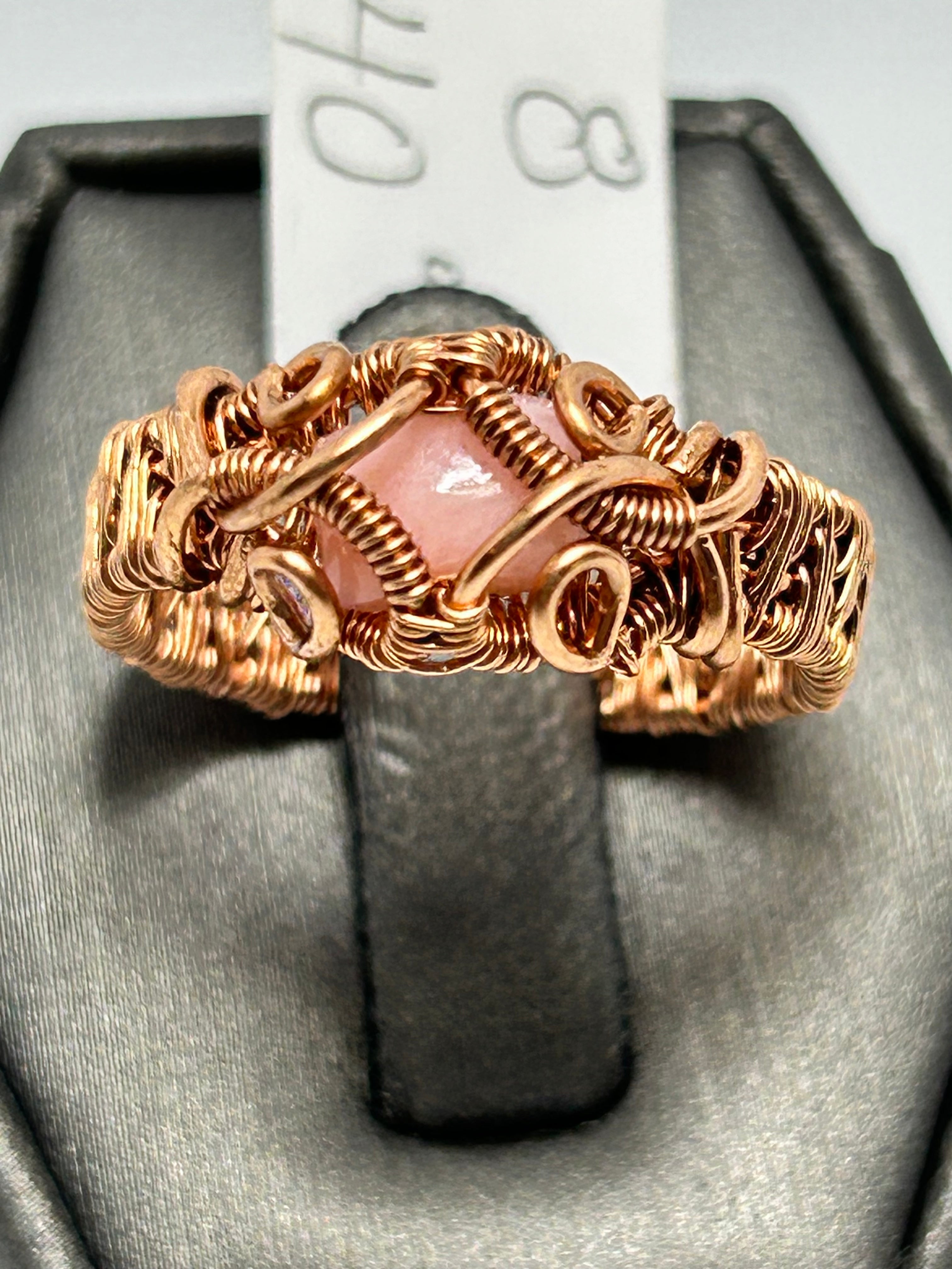 Copper wire wrapped pink opal ring size 8 with diamond frame setting and scroll wire accents