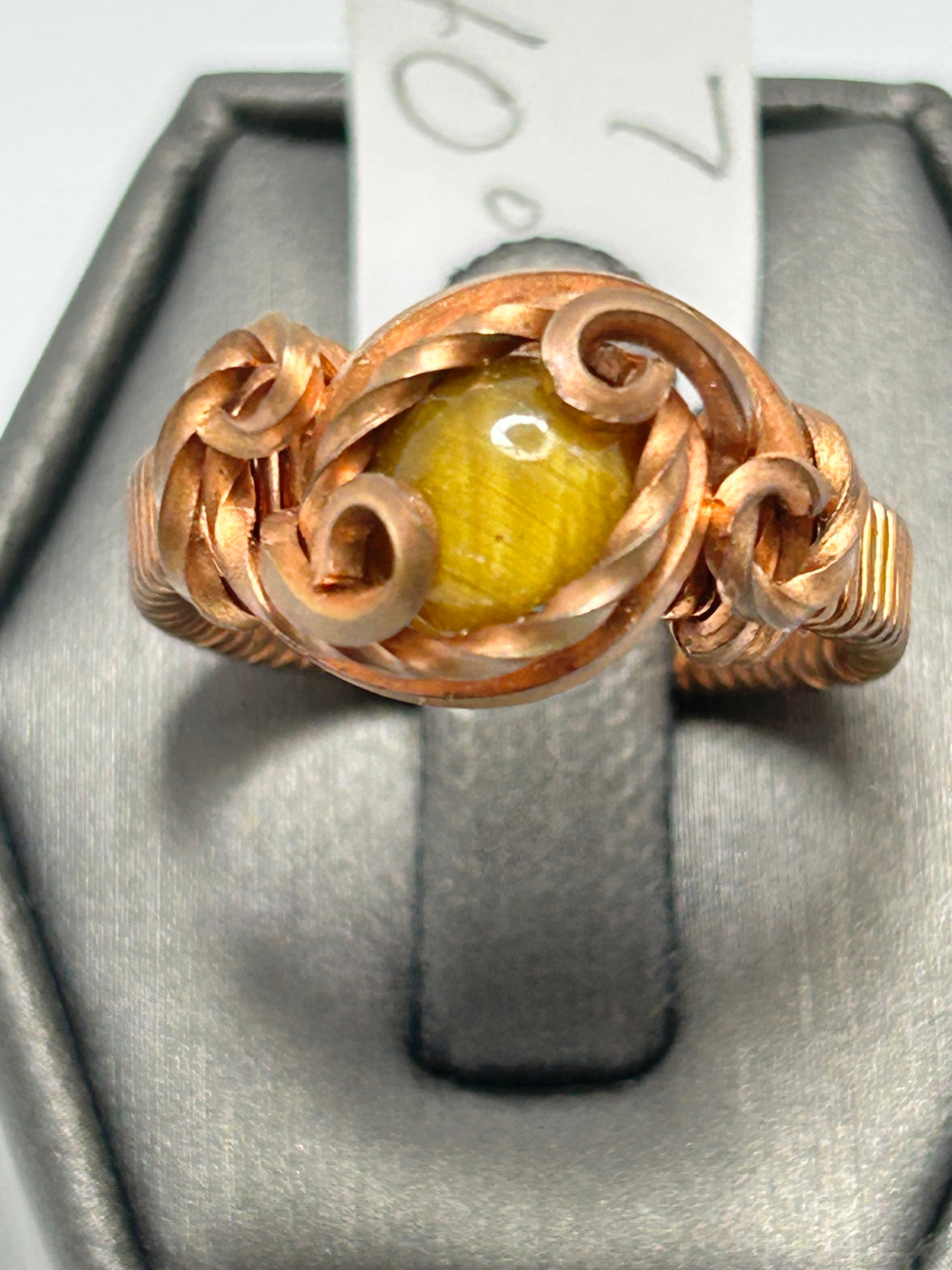 Copper wire wrapped tiger's eye oval cabochon ring size 7 with scroll tendril accents