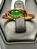 Copper wire wrapped green jade oval cabochon ring size 10.5 with eye-shaped arch frame and coiled band