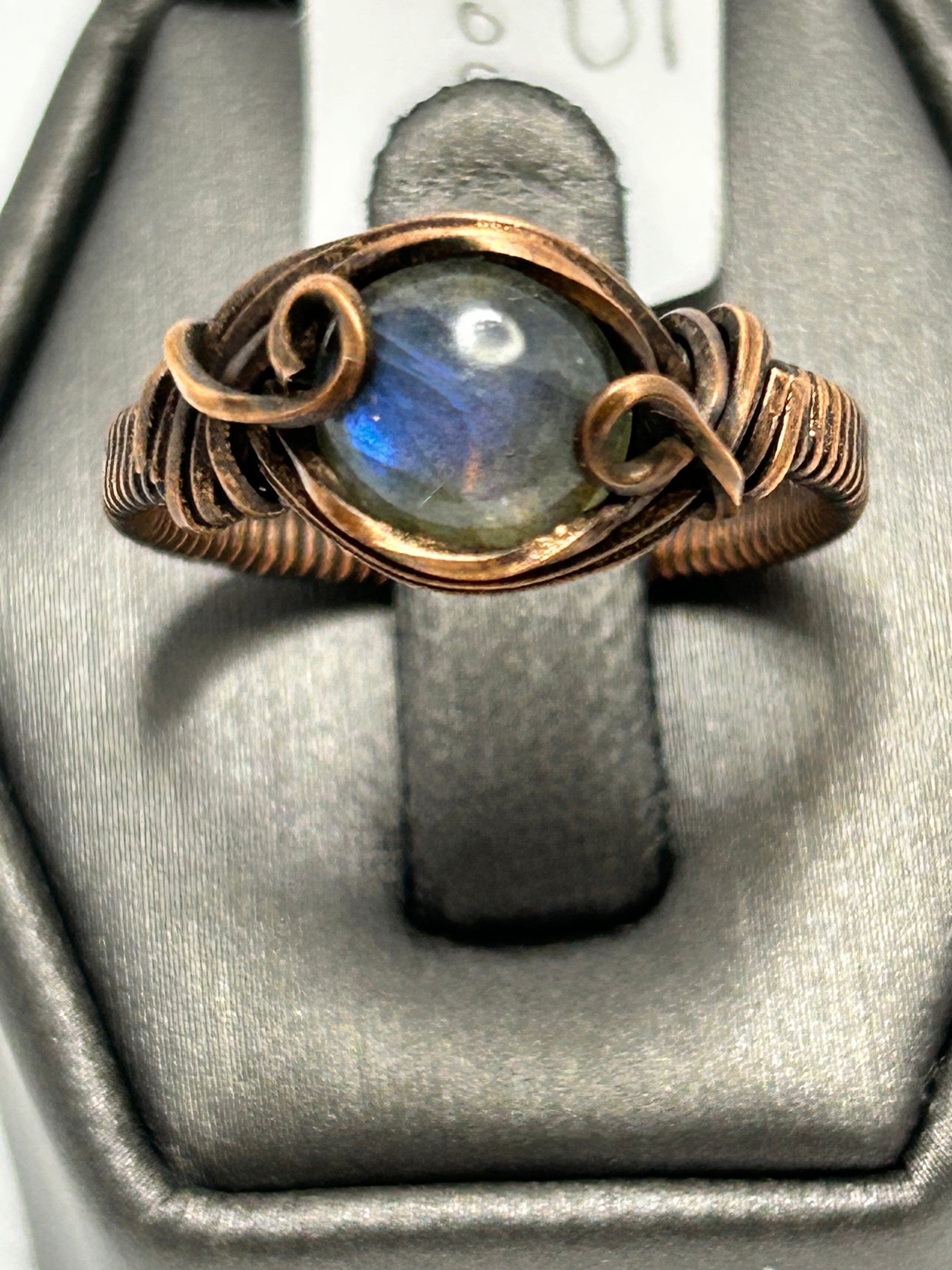 Oxidized copper wire wrapped labradorite round cabochon ring size 7.5 with oval frame and scroll curl tendril accents