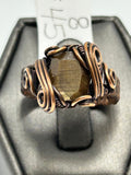 Oxidized copper wire wrapped chocolate sapphire cushion cut ring size 8 with cage setting and scroll curl accents on wide woven band