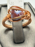 Copper wire wrapped red lightning jasper round cabochon ring size 6 with orbital arch wire cage setting
