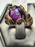 Oxidized copper wire wrapped composite purple turquoise oval cabochon ring size 7.5 with layered cage setting, scroll curl and spiral accents, wide woven band