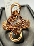 Copper wire wrapped Swarovski crystal princess cut ring size 8 with looping arch infinity knot crown setting and wide woven band