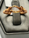 Copper wire wrapped aquamarine pear-shaped cabochon ring size 8 with eye-shaped frame and rose curl side accents