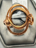 Copper wire wrapped Austrian pinolith oval cabochon ring size 9.5 with orbital arch wire setting and bead and loop side accents