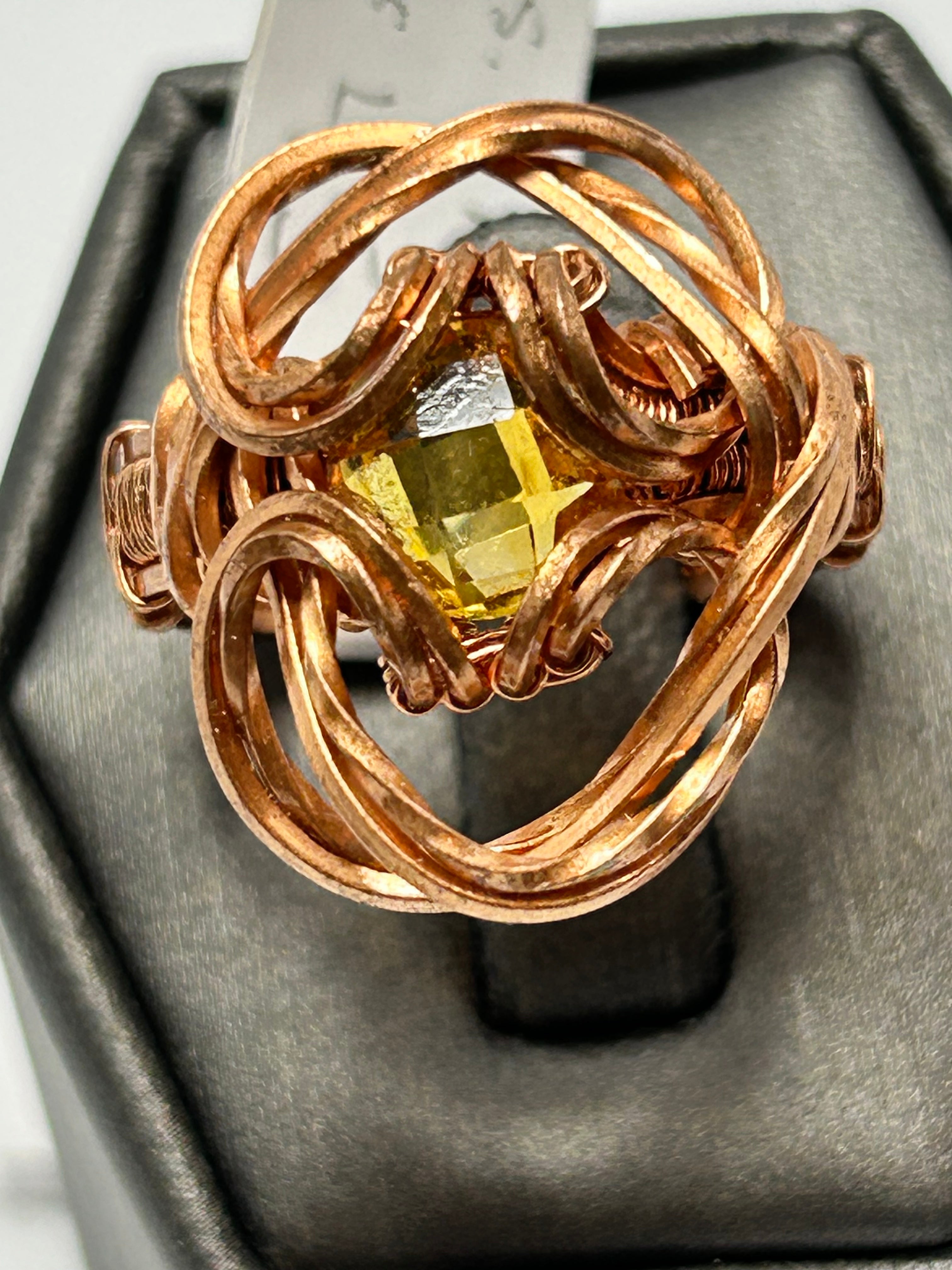 Copper wire wrapped citrine cushion cut ring size 7 with open-weave orbital globe cage setting and scroll curl base accents