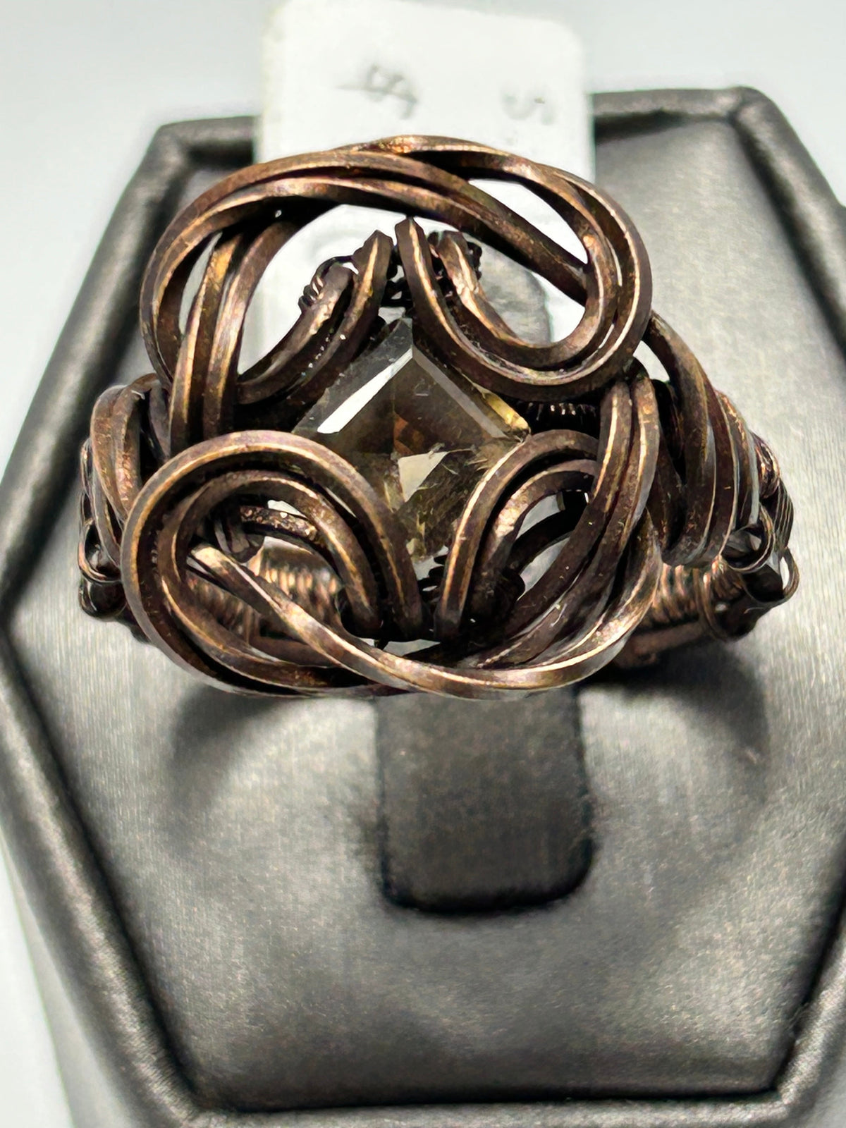 Oxidized copper wire wrapped smoky quartz square cut ring size 10 with swirling open-weave globe cage and fleur-de-lis scroll accents