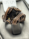 Oxidized copper wire wrapped smoky quartz cushion cut ring size 5 with cross wrap cage setting and triple spiral curl side accents