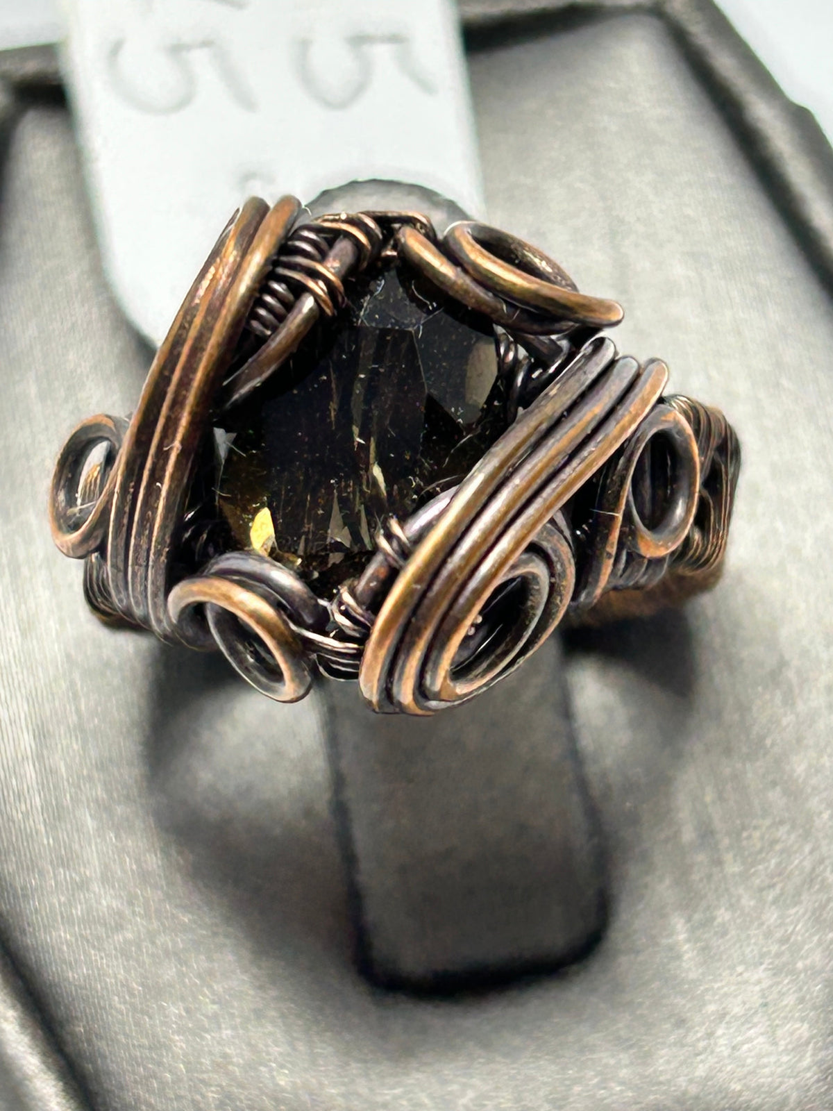 Oxidized copper wire wrapped smoky quartz cushion cut ring size 5 with cross wrap cage setting and triple spiral curl side accents