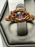Copper wire wrapped labradorite round cabochon ring size 8 with eye-shaped arch wire frame and scroll curl tendril side accents