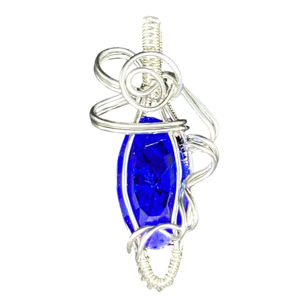 Silver wire wrapped cobalt blue marquise Swarovski crystal pendant with spiral rosette bail on white background
