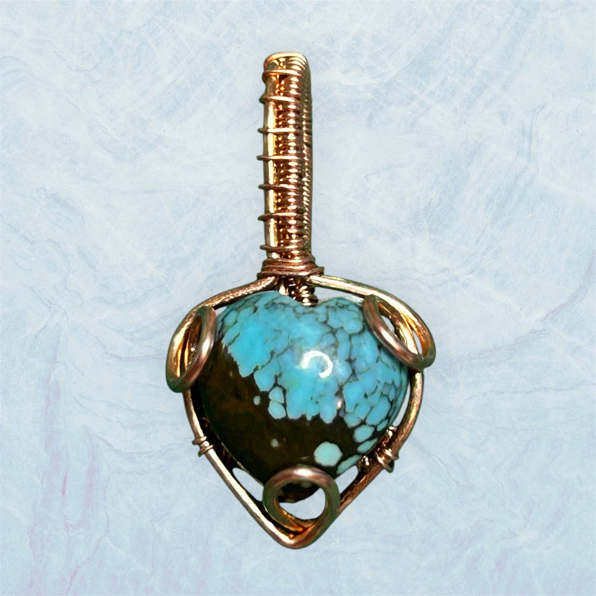 Copper wire wrapped Blue Moon turquoise heart pendant with black matrix stone and coiled copper tube bail, handcrafted by KariJKrafts